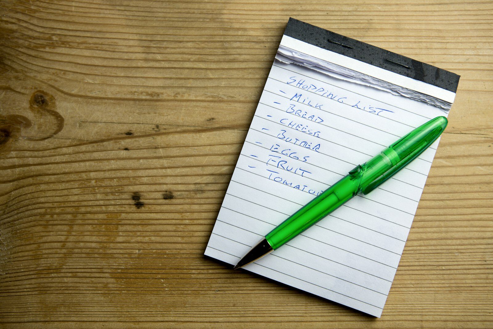 A notepad and pen, ready to write down a number